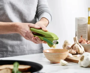 Kitchen Utensils & Gadgets-Joseph Joseph CleanForce™ Garlic Press Green
