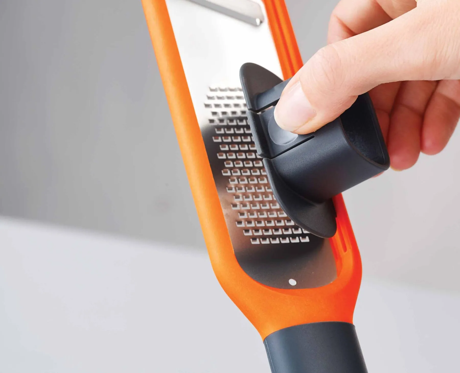 Graters & Zesters-Joseph Joseph Handi-Grate™ 2-in-1 Mini Grater & Slicer Orange