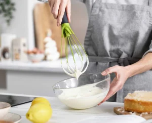 Kitchen Utensils & Gadgets-Joseph Joseph Twist™ 2-in-1 Whisk Green
